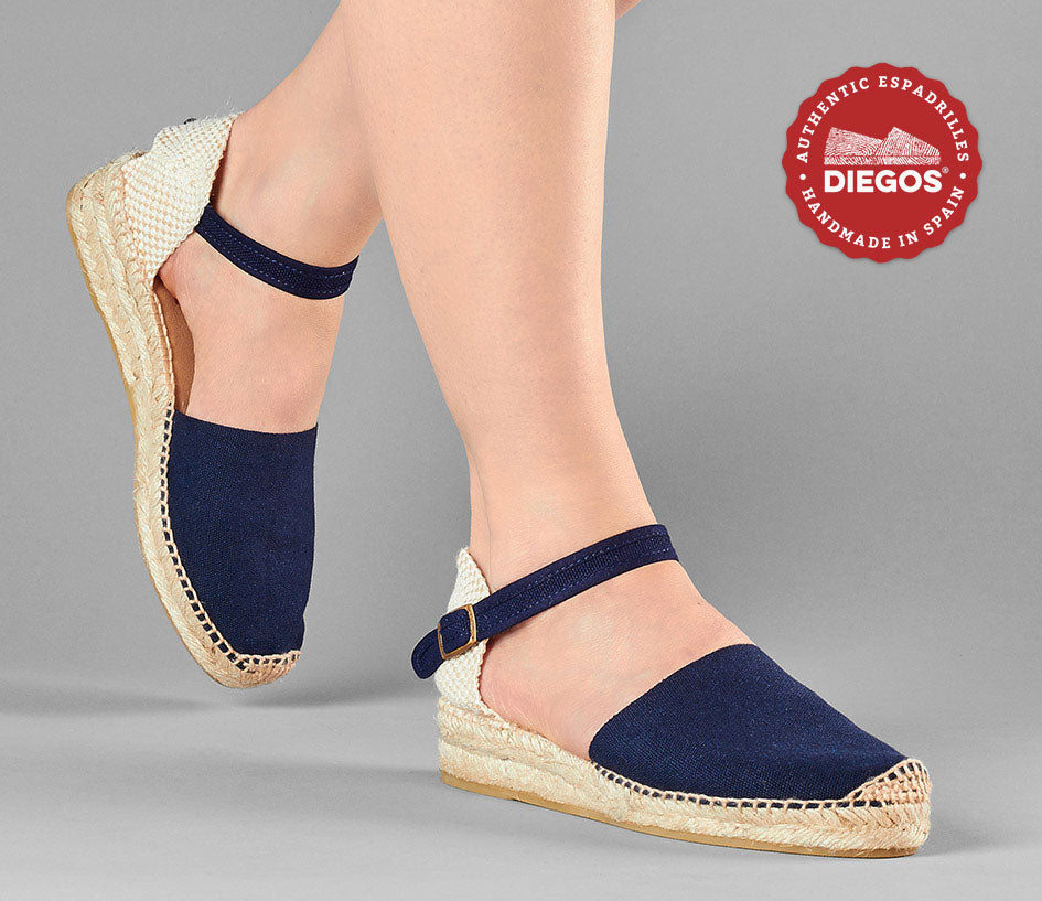 Navy blue espadrilles with low wedge heel and ankle strap